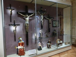 Display case of crucifixes and Pietas