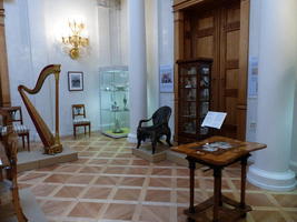 Aristocratic drawing room with harp in background
