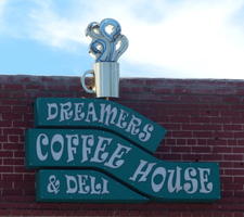 Logo for coffee shop, with 3-d coffee mug that has steam rising from it