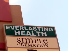 Signs: “Everlasting Health / Simple Cremation”