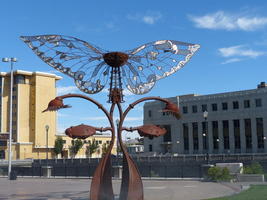 Butterfly-like sculpture in a plaza