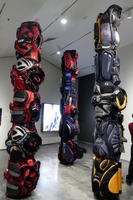 “Totem poles” made from backpacks and soft-sided luggage.