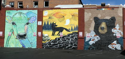 Wall painting of cow, wolf, and bear