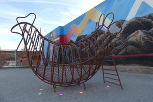 Large wire-frame chicken; doubles as a slide for children