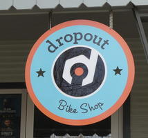 Sign for dropout bike shop, with wrench in form of lower case “d”