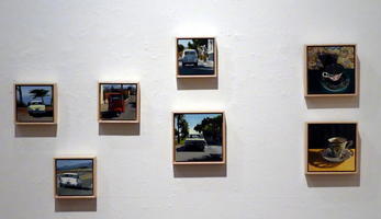 Small oil paintings of cars and teacups