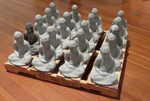 Casts of seated buddha statue on pallet