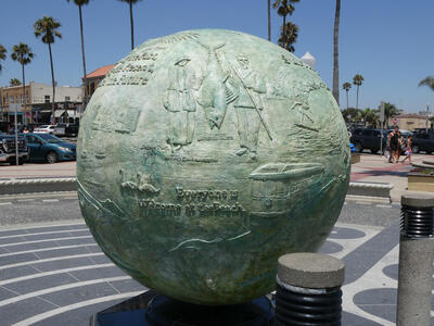 sphere showing Fishers with a fish, and text beneath: Everyone is Welcome at the Beach
