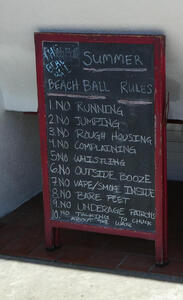 Signboard in front of bar