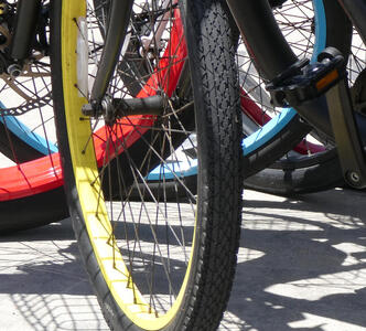 Bicycle tires with red, yellow, and blue rims