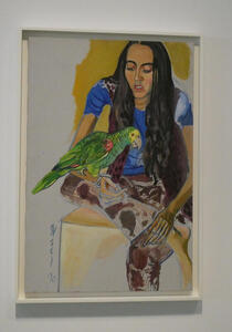 Woman in blue shirt with green parrot