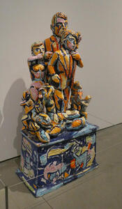 Vividly colored ceramic scuplture of several surprised people.