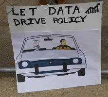 Car with Data from Star Trek driving and a bill from Schoolhouse Rock in passenger seat: “Let Data drive policy”