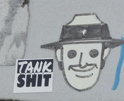 Sticker “Tank shit” and pen drawing of man in hat.