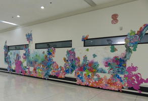 Swirly flower-like design painted on wall.