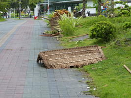 typhoon damaged thatched roof