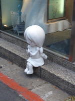 statue of child at patisserie