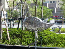metallic crane sculpture