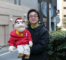 japanese ventriloquist holding dummy