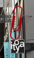 store sign in shape of large red paper clip