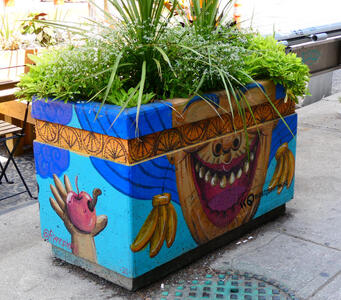 grinning person planter
