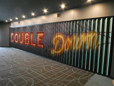 Louvered panels reading ”Double Down” when viewed from an angle