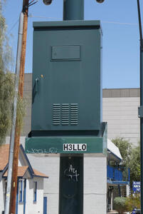 Utility box mounted on utility pole; ID tag says H3LLO