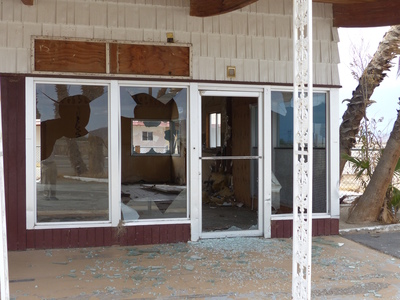 Front lobby of hotel with broken windows