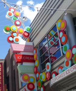Multi-colored circles on sign for “Sprinkles” cupcake store