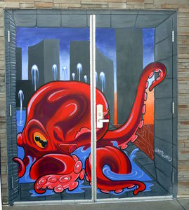 Red squid painted on door