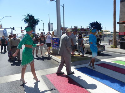 Mayor Oscar Goodman and showgirls doing the Abbey Road crossing.