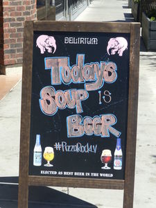 Board in front of pizza restaurant: “Today's Soup is Beer”