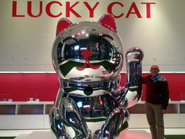 Me standing next to large “Lucky Cat”