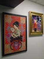 Paintings of Japanese woman on asian background and caucasian woman on Las Vegas street.