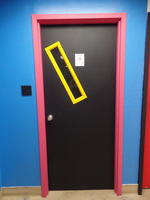 Door with window set at an angle
