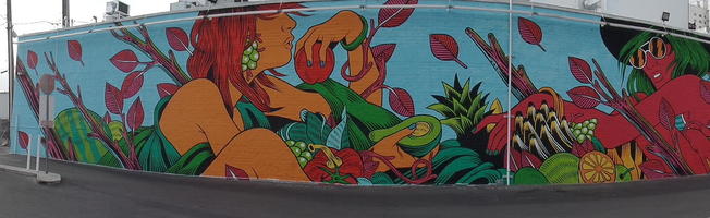 Women and plants painted on side of building