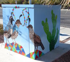 Utility box with quails on one side and cactus on other.