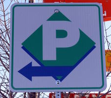 Parking sign with arrow as part of the design