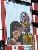 Wall painting of robot and girl with headband made of flowers