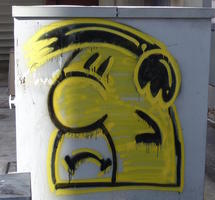 Fred Flintstone face drawn on utility box