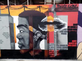 Mural panel showing African-American man with pencil behind ear