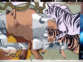 Mural panel showing zebra, tiger, snake, rabbit, and bear