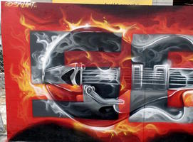 Mural panel showing guitar superimposed on word “SEE”
