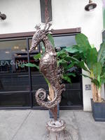 Metal sculpture of seahorse made of scrap metal
