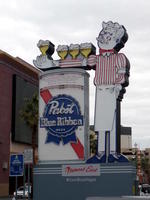 Old neon sign for Pabst beer, showing bartender holding glasses.