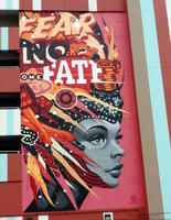 Showgirl in headdress wit chips and dice; words “Fear No Fate”