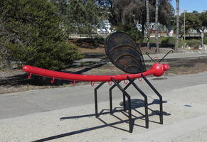 Bicycle rack in form of a red dragonfly