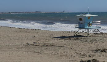 Beach with lifeguard tower at right