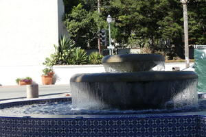 Fountain with outside tiled in blue geometric patterned-tiles.