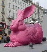 Large statue of a pink hare.